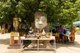 Thailand: Old Buddha head and altar set up for the songkran festival in the grounds of Wat Chetlin, Chiang Mai